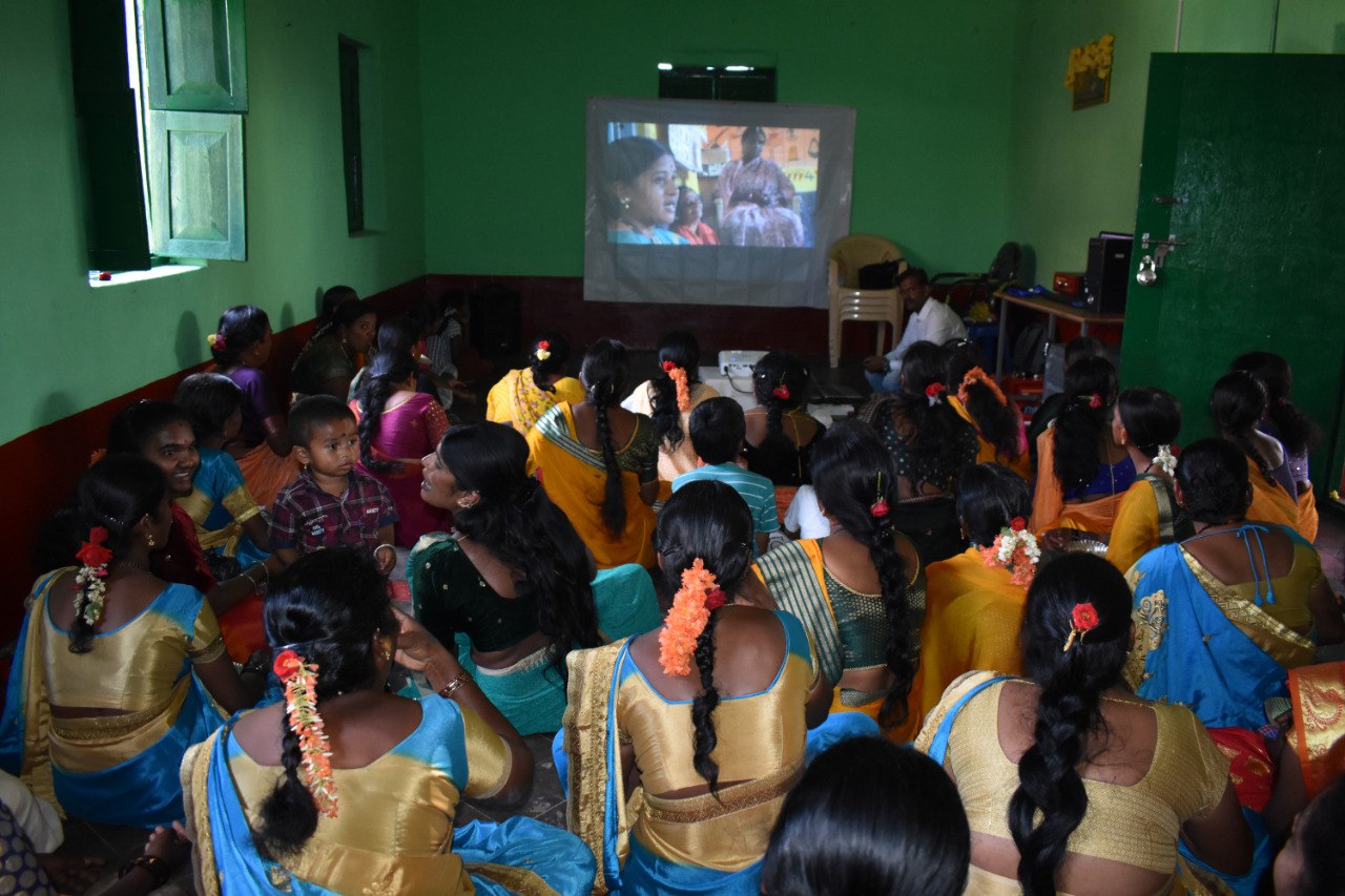 Film screening about the Namma Mahiti Kendra during the information center's inauguration at Hagaranahalli, Karnataka, India.